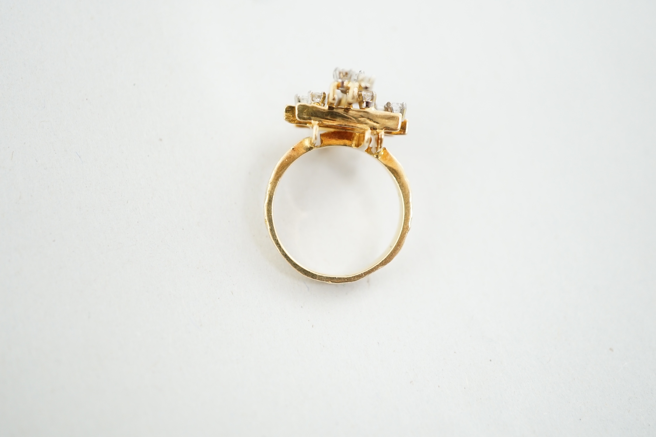 A 1970's 18ct gold and graduated diamond cluster set modernist ring